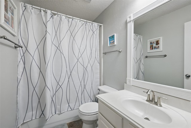 7113 Sundance Ln, Fort Worth, TX 76179 - bathroom featuring a textured ceiling, vanity, toilet, and shower / bath combo
