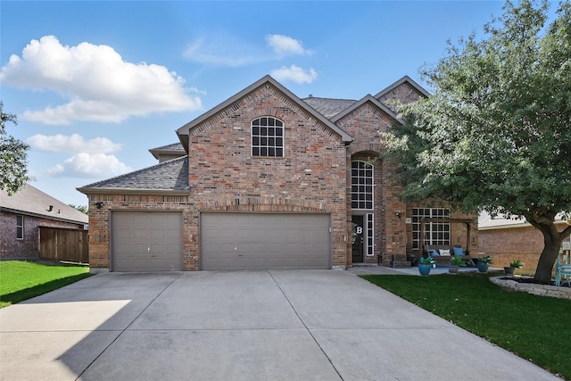 7113 Sundance Ln, Fort Worth, TX 76179 - french country style house featuring driveway, brick siding, an attached garage, and roof with shingles