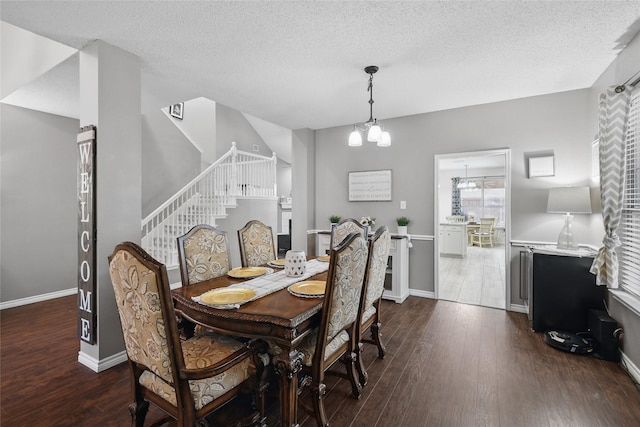 7113 Sundance Ln, Fort Worth, TX 76179 - dining area with dark wood-type flooring, stairs, baseboards, and a textured ceiling