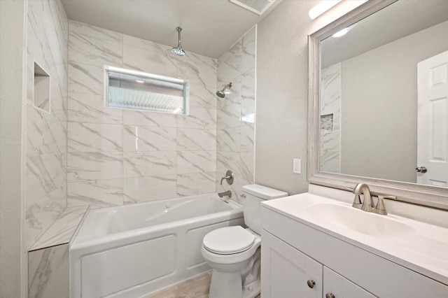 14053 Stardust Ln, Farmers Branch, TX 75234 - bathroom featuring toilet, vanity, and a combined bath / shower with rainfall shower