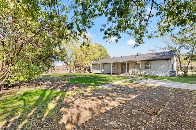 14053 Stardust Ln, Farmers Branch, TX 75234 - back of property with cooling unit and a patio