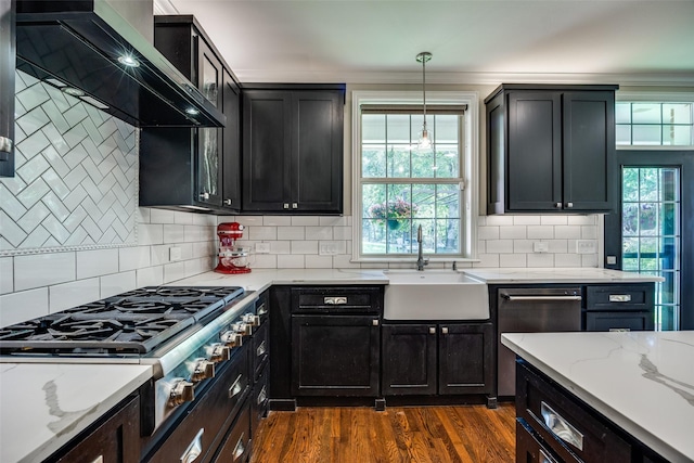 6801 Fm 2709, Athens, TX 75752 - kitchen with wall chimney range hood, stainless steel appliances, a sink, dark wood-style flooring, and dark cabinets