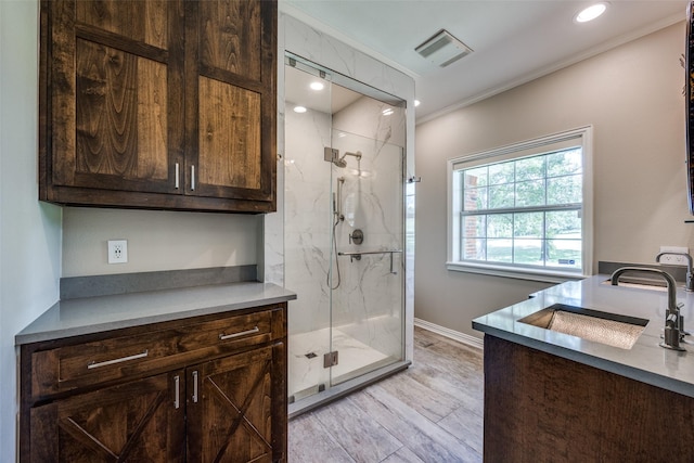 6801 Fm 2709, Athens, TX 75752 - full bathroom featuring vanity, a marble finish shower, ornamental molding, baseboards, and recessed lighting