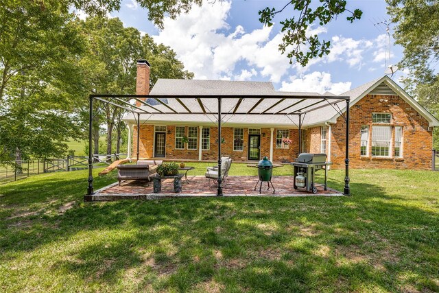 6801 Fm 2709, Athens, TX 75752 - back of house with a chimney, a patio area, and brick siding