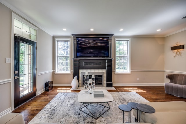 6801 Fm 2709, Athens, TX 75752 - living room featuring crown molding, dark wood-style flooring, healthy amount of natural light, a fireplace, and recessed lighting