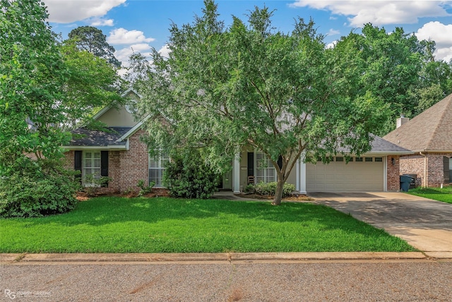 444 Grand Oaks Dr, Shreveport, LA 71106 - view of property hidden behind natural elements featuring brick siding, concrete driveway, a front lawn, an attached garage, and roof with shingles