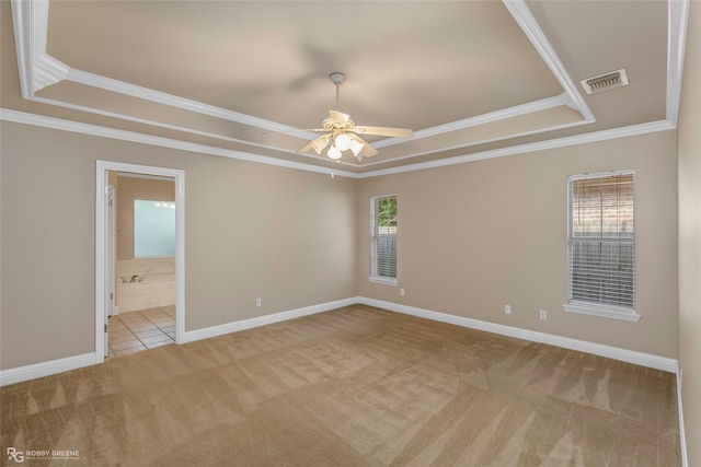 444 Grand Oaks Dr, Shreveport, LA 71106 - carpeted spare room featuring a tray ceiling, ceiling fan, ornamental molding, and baseboards