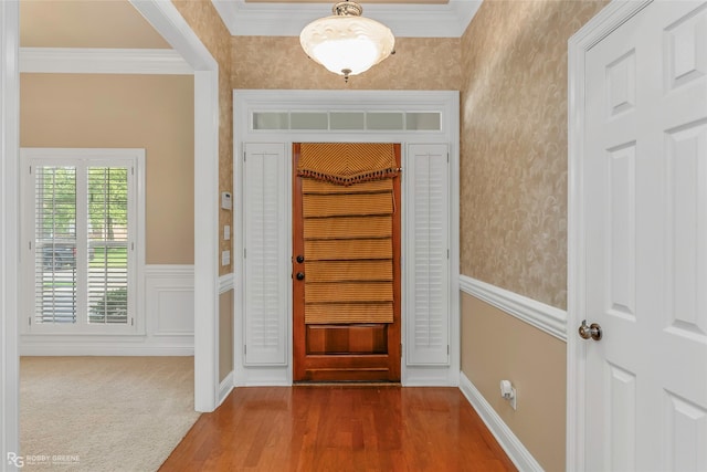 444 Grand Oaks Dr, Shreveport, LA 71106 - entrance foyer with wallpapered walls, ornamental molding, a wainscoted wall, and dark wood-style floors