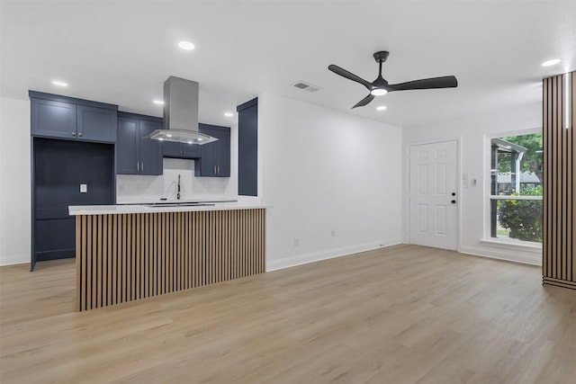 614 Edgedale, Dallas, TX 75232 - kitchen featuring island exhaust hood, light wood-style floors, ceiling fan, decorative backsplash, and recessed lighting