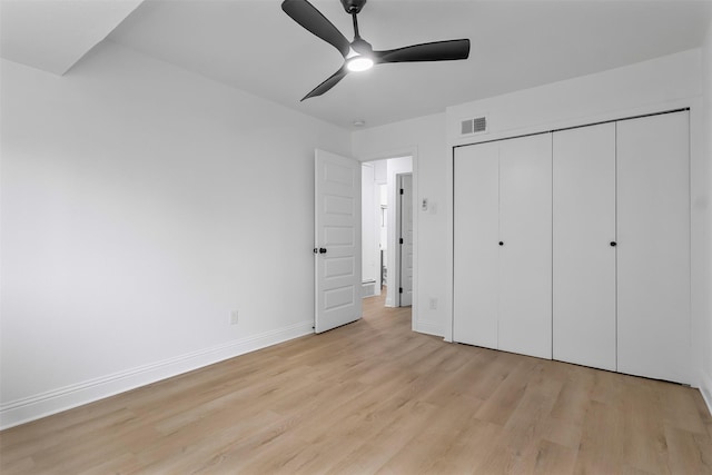 614 Edgedale, Dallas, TX 75232 - unfurnished bedroom featuring light wood-style flooring, baseboards, a closet, and ceiling fan