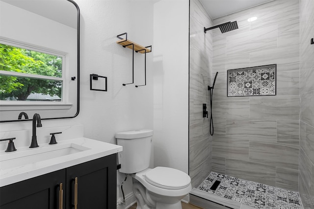 614 Edgedale, Dallas, TX 75232 - full bathroom with vanity, toilet, and tiled shower