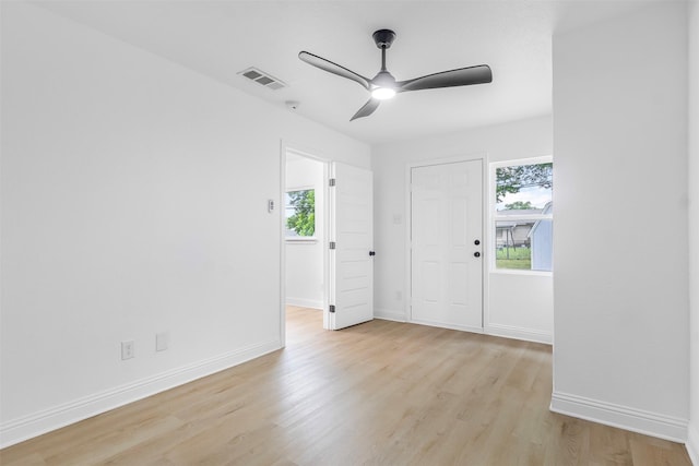 614 Edgedale, Dallas, TX 75232 - unfurnished room featuring ceiling fan, light wood-style flooring, plenty of natural light, and baseboards