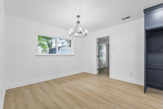 614 Edgedale, Dallas, TX 75232 - spare room with light wood finished floors, a chandelier, healthy amount of natural light, and baseboards