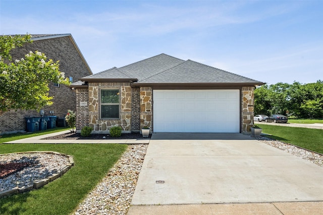 2405 La Costa Dr, Rowlett, TX 75088 - view of front of property with a front yard, a garage, stone siding, concrete driveway, and roof with shingles