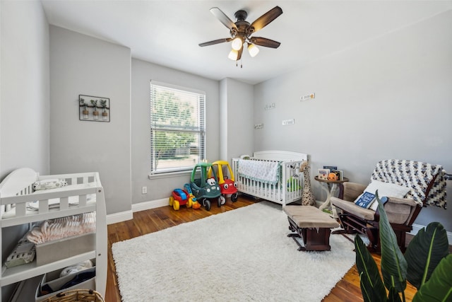 2405 La Costa Dr, Rowlett, TX 75088 - bedroom featuring wood finished floors, baseboards, and ceiling fan