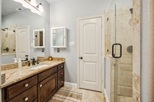 2405 La Costa Dr, Rowlett, TX 75088 - bathroom featuring vanity, a stall shower, tile patterned flooring, and baseboards