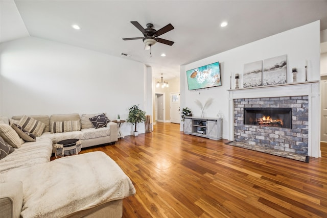 2405 La Costa Dr, Rowlett, TX 75088 - living area featuring wood finished floors, ceiling fan, a fireplace, recessed lighting, and a chandelier