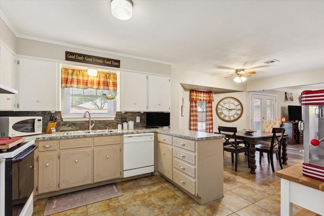 109 S Patricia St, Waco, TX 76705 - kitchen with white appliances, a sink, a peninsula, decorative backsplash, and ornamental molding