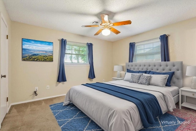 109 S Patricia St, Waco, TX 76705 - carpeted bedroom with ceiling fan, baseboards, and a textured ceiling