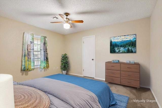 109 S Patricia St, Waco, TX 76705 - bedroom with light colored carpet, baseboards, ceiling fan, and a textured ceiling
