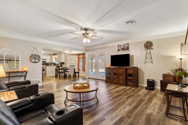 109 S Patricia St, Waco, TX 76705 - living room with french doors, wood finished floors, a ceiling fan, baseboards, and crown molding