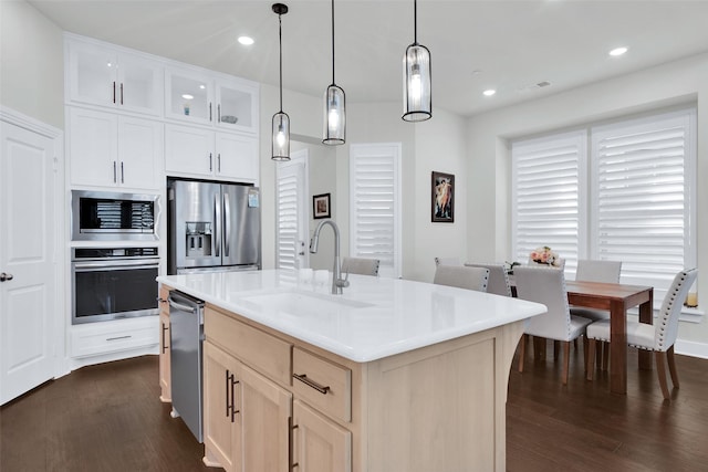 3736 Queen Rd, Sherman, TX 75090 - kitchen featuring stainless steel appliances, a sink, dark wood-style flooring, hanging light fixtures, and light countertops