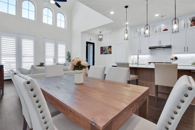 3736 Queen Rd, Sherman, TX 75090 - dining area featuring a ceiling fan, dark wood-style floors, recessed lighting, and a towering ceiling
