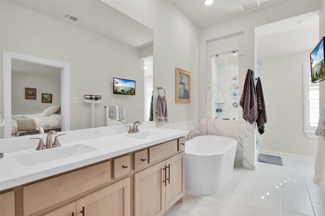 3736 Queen Rd, Sherman, TX 75090 - full bath with a freestanding tub, ensuite bathroom, double vanity, tile patterned flooring, and a shower