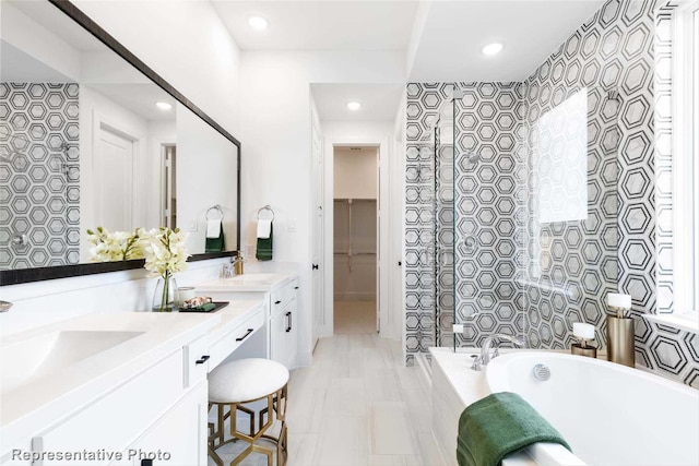 11760 Edgewood Dr, Justin, TX 76247 - full bathroom with double vanity, a bath, recessed lighting, and a tile shower
