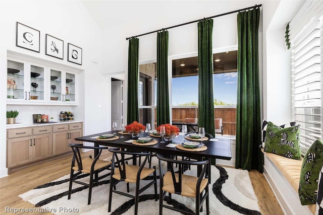 11760 Edgewood Dr, Justin, TX 76247 - dining area featuring light wood-style floors and high vaulted ceiling