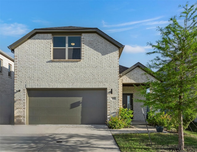 307 Bertney Dr, Princeton, TX 75071 - french country style house featuring a garage, driveway, and brick siding