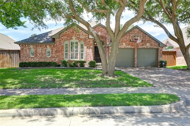 3401 Beckingham Ct, Flower Mound, TX 75022 - view of front of house featuring brick siding, an attached garage, driveway, and a shingled roof