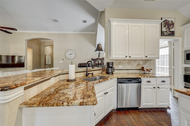 3401 Beckingham Ct, Flower Mound, TX 75022 - kitchen with stainless steel appliances, a sink, dark wood-type flooring, a peninsula, and light stone countertops