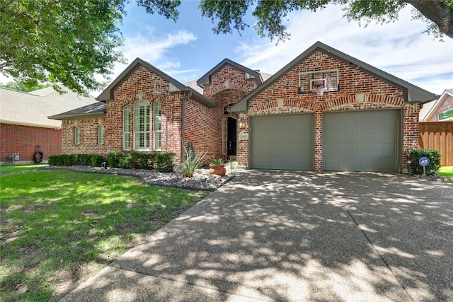 3401 Beckingham Ct, Flower Mound, TX 75022 - view of front facade featuring an attached garage, brick siding, driveway, and a front yard