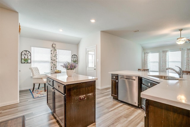 6100 True Vine Rd, Fort Worth, TX 76123 - kitchen featuring dishwasher, a center island, a sink, light countertops, and light wood finished floors