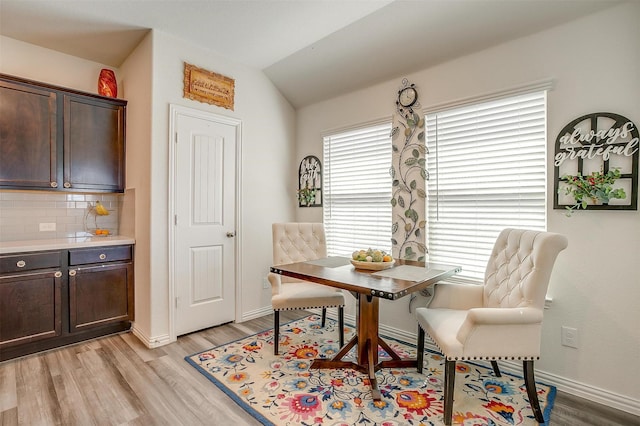 6100 True Vine Rd, Fort Worth, TX 76123 - dining area with light wood-type flooring, vaulted ceiling, and baseboards