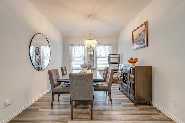 6100 True Vine Rd, Fort Worth, TX 76123 - dining space featuring a chandelier, wood finished floors, and baseboards
