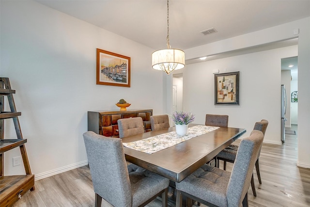 6100 True Vine Rd, Fort Worth, TX 76123 - dining space with light wood-style floors, baseboards, and a chandelier