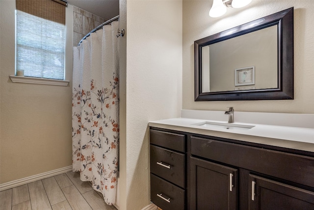 2446 Catherine St, Dallas, TX 75211 - full bath featuring vanity, baseboards, and a shower with curtain