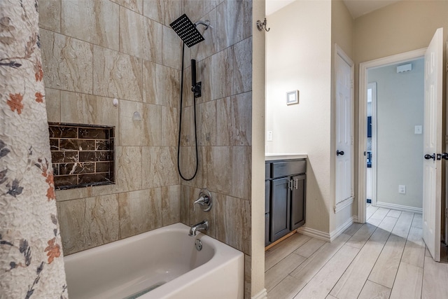 2446 Catherine St, Dallas, TX 75211 - full bath with shower / tub combination, wood finish floors, baseboards, and vanity