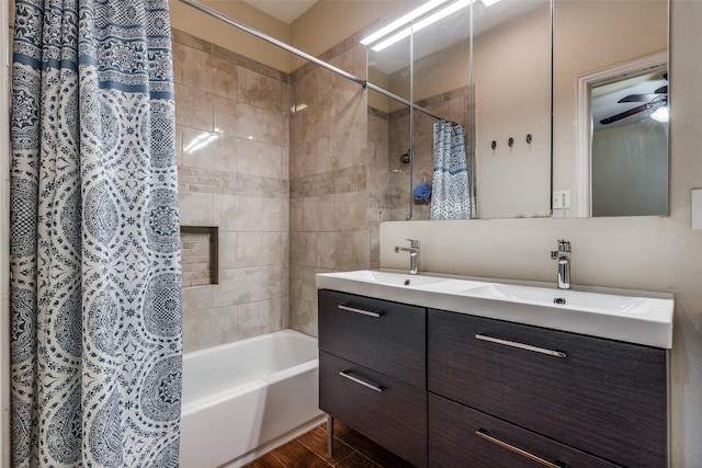 2446 Catherine St, Dallas, TX 75211 - full bath with shower / bathtub combination with curtain, double vanity, ceiling fan, and wood finished floors