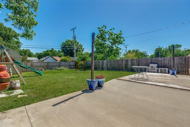 2446 Catherine St, Dallas, TX 75211 - view of yard with a patio area and a playground