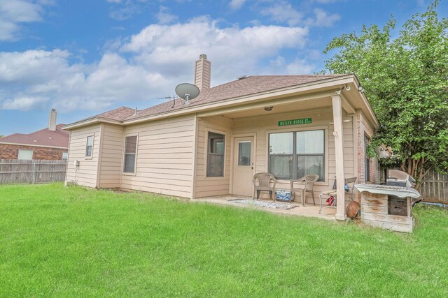 4109 Seminole Trl, Granbury, TX 76048 - rear view of property featuring a chimney