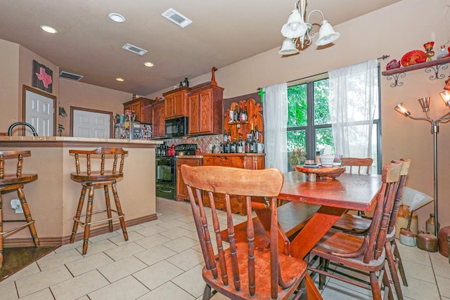 4109 Seminole Trl, Granbury, TX 76048 - dining space with a chandelier, recessed lighting, light tile patterned floors, and baseboards