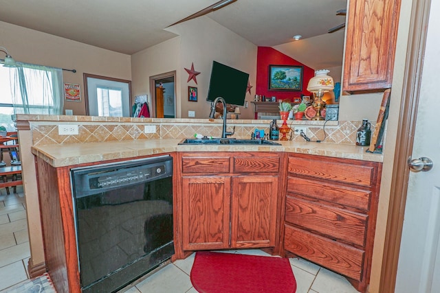 4109 Seminole Trl, Granbury, TX 76048 - kitchen with black dishwasher, a sink, a peninsula, and light countertops