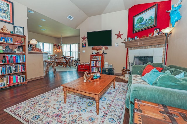 4109 Seminole Trl, Granbury, TX 76048 - living room with wood finished floors, lofted ceiling, and a fireplace
