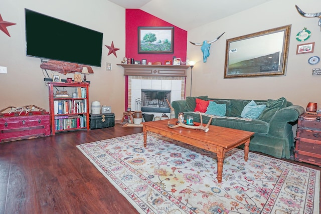 4109 Seminole Trl, Granbury, TX 76048 - living room featuring wood finished floors, lofted ceiling, and a tile fireplace