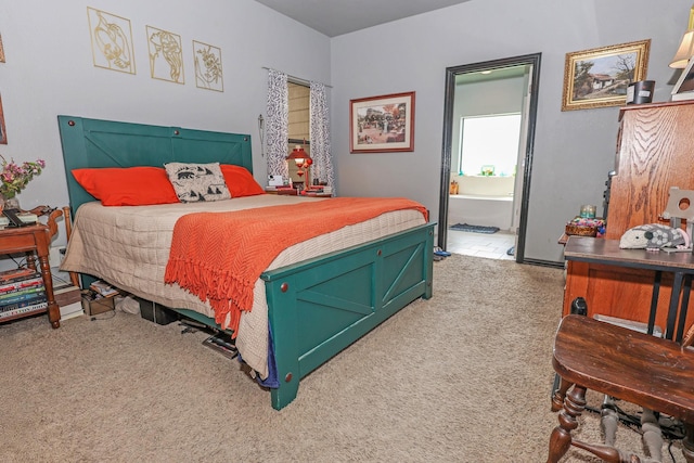 4109 Seminole Trl, Granbury, TX 76048 - carpeted bedroom featuring ensuite bathroom