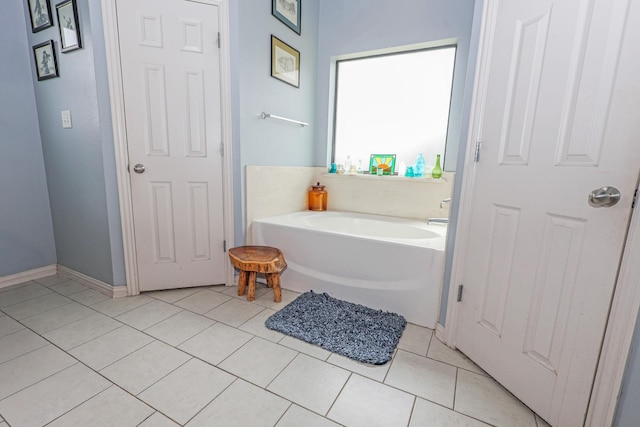 4109 Seminole Trl, Granbury, TX 76048 - bathroom with a garden tub, tile patterned flooring, and baseboards