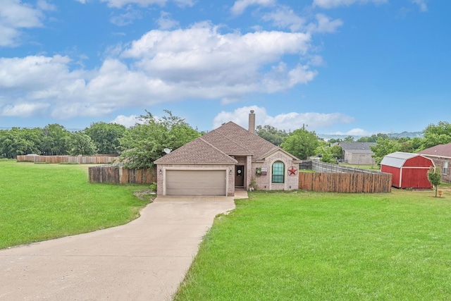 4109 Seminole Trl, Granbury, TX 76048 - view of front facade with brick siding, driveway, a garage, a chimney, and a storage shed